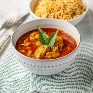 Homemade Chicken Tikka curry with tender marinated chicken in a rich spiced tomato sauce